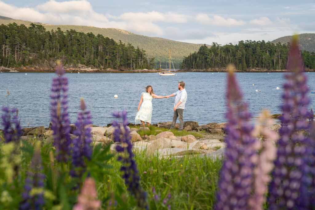 couple in Acadia harbor with lupine