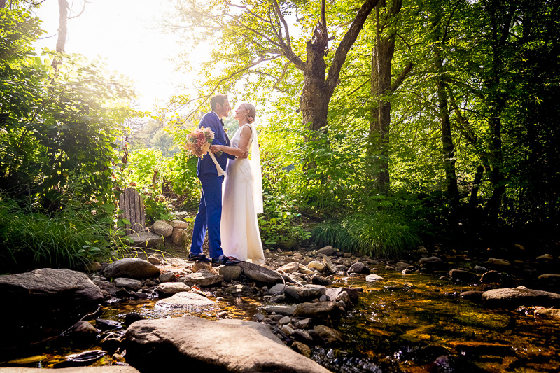 Bride groom near river water Grafton Inn