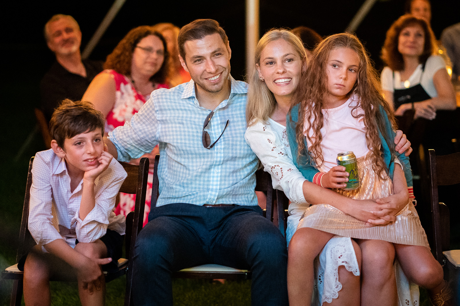 Wedding couple enjoys toasts with family