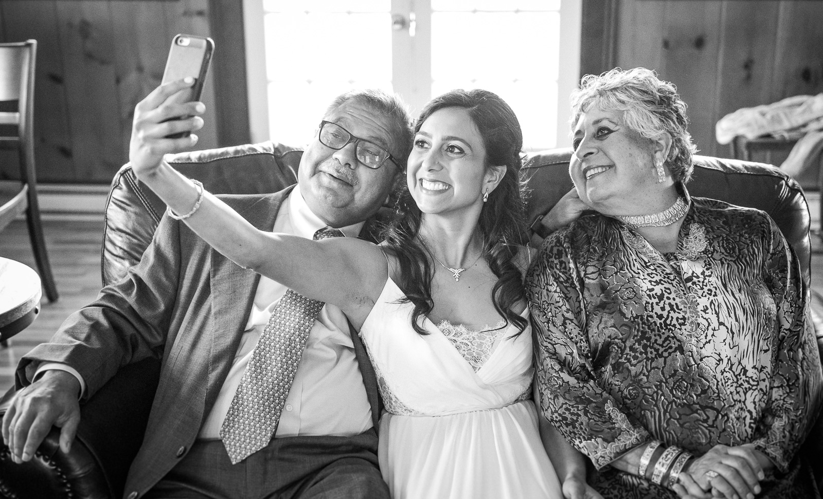 Bride selfie with parents