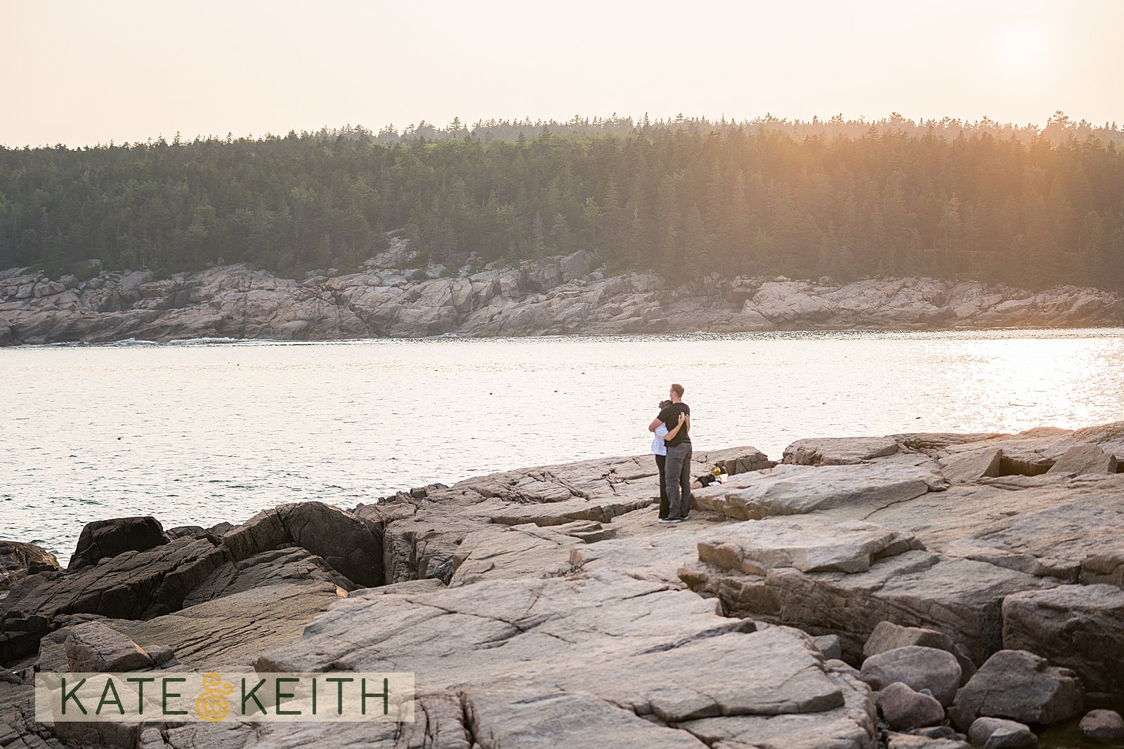Otter Cliff secret proposal, couple hugging