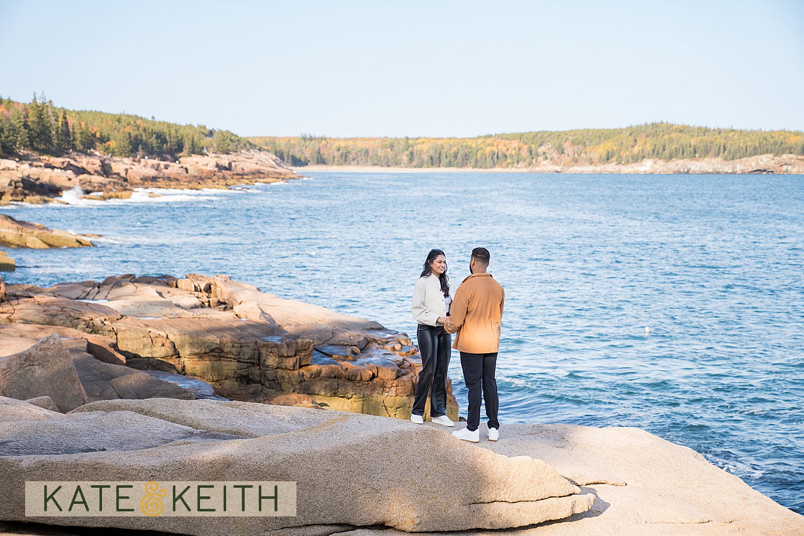 Proposal in Acadia National Park with ocean and fall foliage