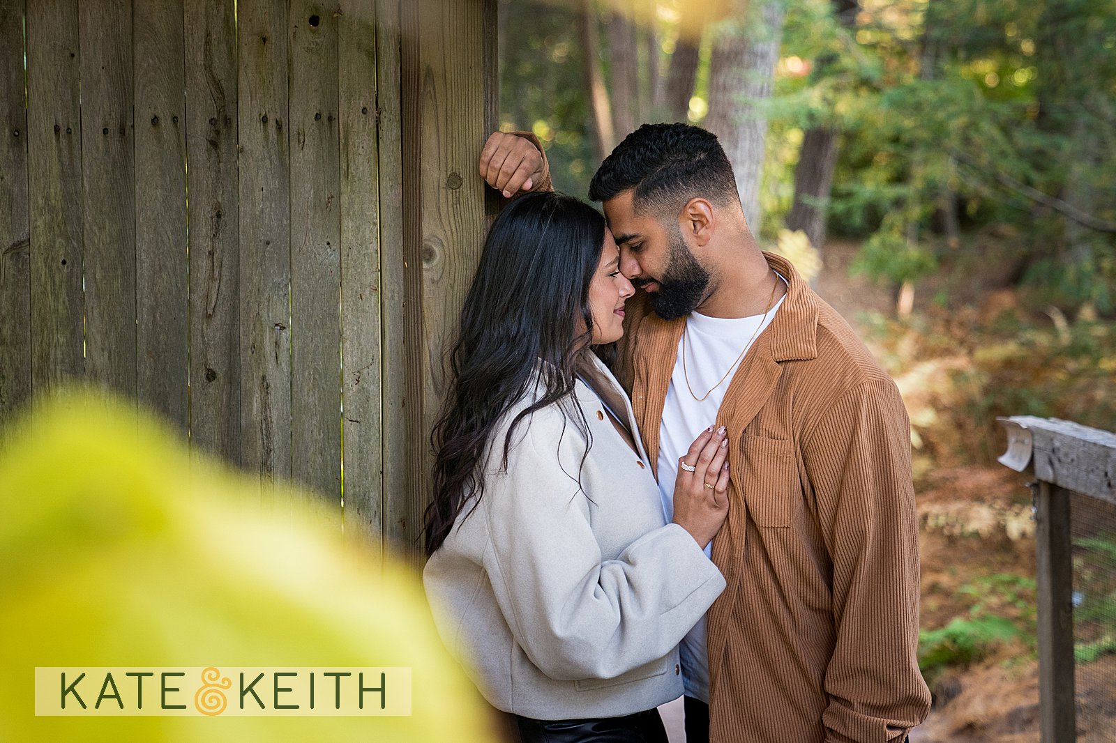 Intimate couple amidst fall garden foliage on Mount Desert Island