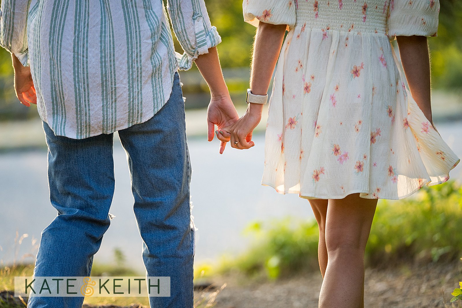 close up of a couple holding hands as they walk away