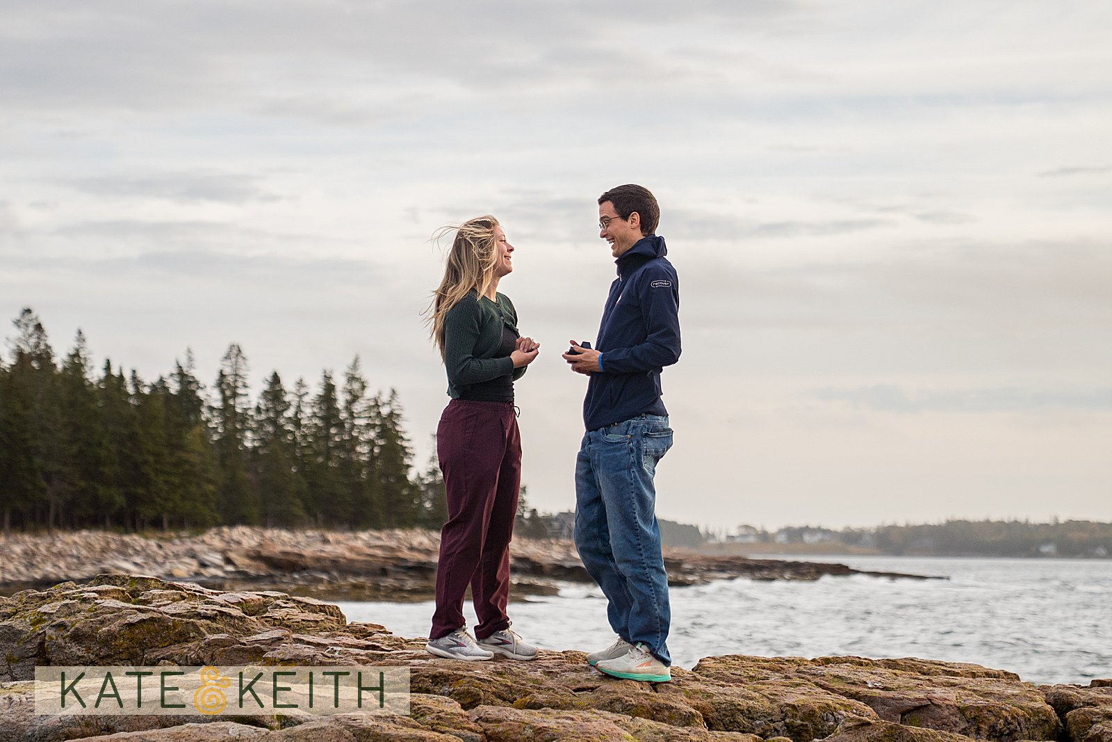 couple celebrating surprise proposal in Acadia