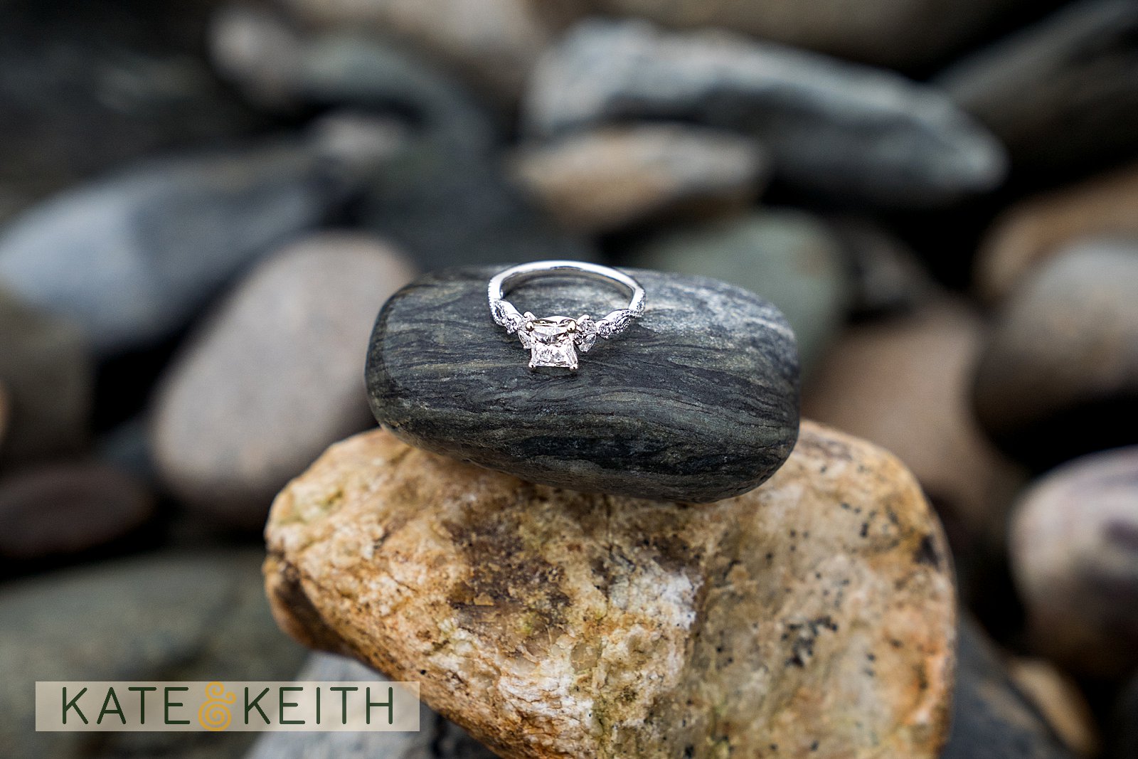 engagement ring on rocks on Acadia National Park beach